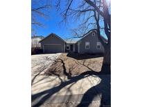 Charming single Gathering home with attached garage, nice front yard and mature trees at 16136 E Exposition Dr, Aurora, CO 80017