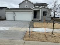 Charming two-story home with a two-car garage and inviting front entrance at 5700 Ranch St, Mead, CO 80504