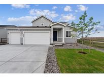 Charming two-story home featuring a two-car garage, landscaped yard, and inviting front entrance at 5700 Ranch St, Mead, CO 80504