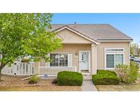 Charming single-story home featuring a well-maintained lawn, inviting porch, and classic architectural details at 20835 E 47Th Ave, Denver, CO 80249