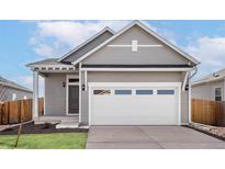 Charming single-Gathering home with a two-car garage and inviting front porch at 9444 Yampa St, Commerce City, CO 80022