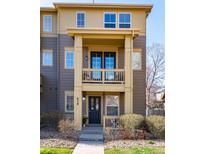Charming townhome featuring a welcoming front porch and well-maintained landscaping at 658 Casper Dr, Lafayette, CO 80026