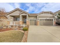 Charming single-Gathering home featuring a well-manicured lawn, porch, and an attached two-car garage at 2342 Bellavista St, Castle Rock, CO 80109