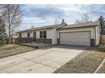 Charming ranch style home with a two-car garage and inviting curb appeal at 9256 W Euclid Ave, Littleton, CO 80123