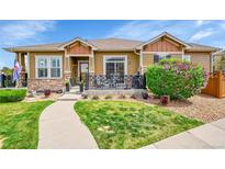 Charming single-story home with a well-manicured lawn and inviting front porch at 3751 W 136Th Ave # F4, Broomfield, CO 80023
