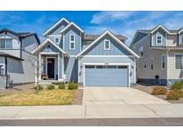 Charming two-story home with a two-car garage and low maintenance front yard at 27837 E 8Th Ave, Aurora, CO 80018