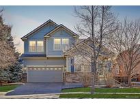 Charming two-story home with a two-car garage and well-maintained lawn at 9978 Salida St, Commerce City, CO 80022