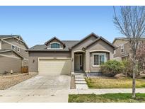 Charming single-Gathering home featuring a neutral color scheme, attached garage, and well-maintained landscaping at 12853 E 108Th Ave, Commerce City, CO 80022