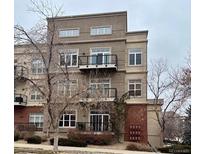 Three-story condo building features multiple balconies and large windows providing lots of natural light at 5677 S Park Pl # A110, Greenwood Village, CO 80111