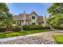 Charming two-story home with well-maintained landscaping and beautiful stone details at 2117 S Troy Way, Aurora, CO 80014
