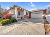 Charming single-Gathering home with a two-car garage and a inviting blue front door at 3626 E 106Th Ave, Thornton, CO 80233