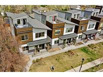 Modern townhome complex with gray roofs and unique architectural design at 4035 Fenton Ct, Wheat Ridge, CO 80212