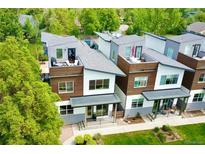 Modern townhomes feature private rooftop decks and stylish exteriors in a lush, green neighborhood at 4035 Fenton Ct, Wheat Ridge, CO 80212