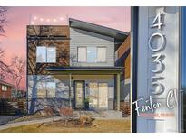Modern two-story home with a unique design and inviting front porch, complemented by a stylish address marker at 4035 Fenton Ct, Wheat Ridge, CO 80212