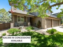Charming two-story home with a welcoming front porch and a spacious two-car garage at 3791 Charterwood Cir, Highlands Ranch, CO 80126