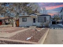 Charming single story home with tidy front yard landscaping and detached garage at 2158 S Ash St, Denver, CO 80222