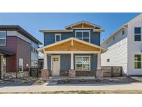 Charming two-story home with a covered porch and craftsman-style detailing at 920 Promenade Dr, Superior, CO 80027