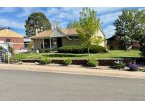 Charming single story home with well manicured lawn, tidy landscaping, and brick accents at 3531 E 91St Ave, Thornton, CO 80229
