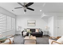 Relaxing living room offers a comfortable sofa and inviting natural light through the window at 152 S Jackson St, Denver, CO 80209