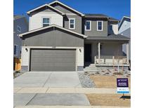 Charming two-story home featuring a covered porch, attached two-car garage and newly landscaped front yard at 1397 Brookfield Pl, Erie, CO 80026
