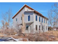 Contemporary two-story house with large windows and a unique design at 13581 Sable Blvd, Brighton, CO 80601