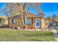 Charming brick home featuring a well-maintained front yard and a classic architectural design at 382 S Decatur St, Denver, CO 80219