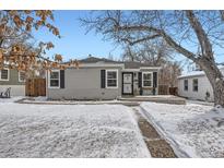 Gray house with black shutters, snowy front yard, and walkway at 2354 S Ogden St, Denver, CO 80210