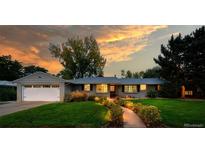 Beautiful ranch home with landscaped lawn and walkway at 2775 E Dartmouth Ave, Denver, CO 80210