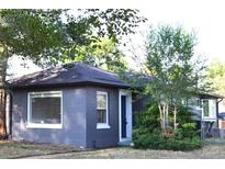 Charming single-story home with a brick exterior, well-maintained landscaping, and a welcoming entrance at 1300 Spruce St, Denver, CO 80220