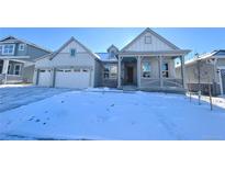 Two-story craftsman style home with a covered porch and attached two-car garage at 3904 Treadway Pt, Castle Rock, CO 80108