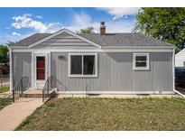 Charming exterior featuring a gray painted home with a well-maintained front yard at 201 4Th St, Frederick, CO 80530