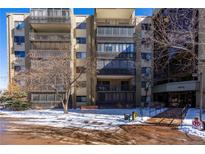 Multi-story condominium building with balconies, a bench and an accessible entrance with a ramp at 14152 E Linvale Pl # 109, Aurora, CO 80014
