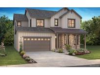 Charming two-story home with stone accents, two car garage and landscaped front yard at 11261 Moonshimmer St, Littleton, CO 80125