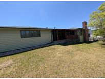 The exterior of the house features a backyard with a screened-in porch at 327 S Pine St, Elizabeth, CO 80107