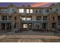Inviting condo exterior with well-maintained landscaping and attractive architectural details at 452 Black Feather Loop # 606, Castle Rock, CO 80104