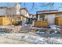 Attractive exterior of a townhome with a walkway and landscaping at 990 S Locust St # D, Denver, CO 80224