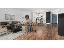 Living room featuring stylish furnishings, wood floors, and contemporary decor at 7020 E Girard Ave # 209, Denver, CO 80224