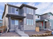 Attractive two-story home showcasing stylish exterior, well-maintained landscaping and charming curb appeal at 21091 E 63Rd Dr, Aurora, CO 80019
