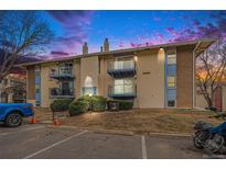 Charming condominium building featuring multiple balconies with black metal railings and a well-maintained lawn at 12191 Melody Dr # 301, Westminster, CO 80234