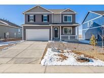 Charming two-story home features a large driveway, two-car garage, and covered front porch at 3226 Belleville Ridge Rd, Elizabeth, CO 80107