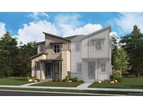 Charming two-story home with stone accents, modern siding, manicured lawn and attractive curb appeal at 6668 N Nepal Ct, Aurora, CO 80019