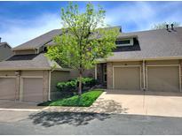 Inviting townhouse featuring a well-manicured lawn and attached garages at 1470 S Quebec Way # 46, Denver, CO 80231