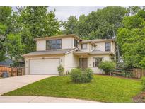 Charming two-story home featuring a well-maintained lawn and a two-car garage at 912 S Galena St, Aurora, CO 80247