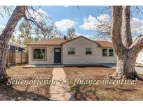 Charming single-story home with a well-maintained lawn and inviting front entrance at 1969 Uinta St, Denver, CO 80220