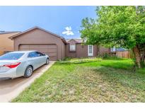 Charming single-Gathering home with an attached garage and mature shade tree at 11599 Kendall St, Westminster, CO 80020