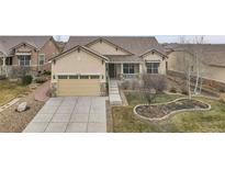 Ranch style home with a landscaped yard and two-car garage at 4280 Crystal Dr, Broomfield, CO 80023