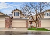 Charming townhome with a two-car garage and beautifully maintained front yard at 3179 S Indiana St, Lakewood, CO 80228