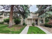 Inviting townhouse with well-maintained lawn and mature trees at 1818 S Quebec Way # 5-7, Denver, CO 80231