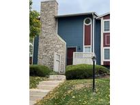 Charming townhouse with stone accents, landscaped front yard, and welcoming curb appeal at 10008 Quivas St, Thornton, CO 80260