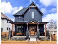 Charming two-story home with a covered front porch and craftsman details at 2951 S Logan St, Englewood, CO 80113